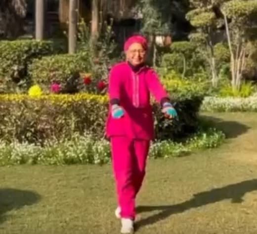 A senior Move U Go client exercising in a garden