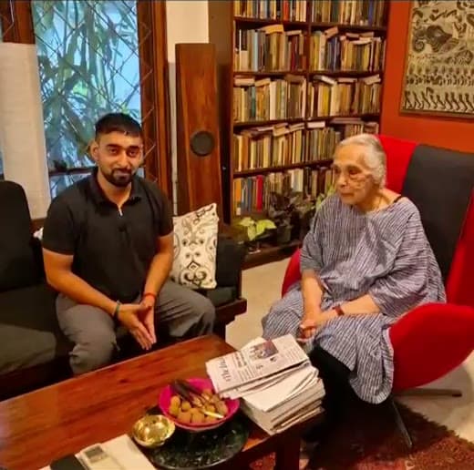 A senior Move U Go client in her armchair at home, with her Move U Go expert